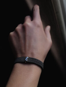 Elastic steel bracelet with gold letter