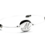 <b>Illusion</b><br> Bracciale con iniziale incisa e zirconi