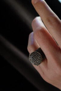 Elastic steel ring with silver decoration and black zirconia