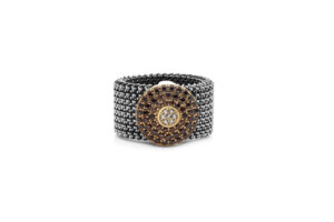 Elastic steel ring with a silver decoration and brown zirconia.